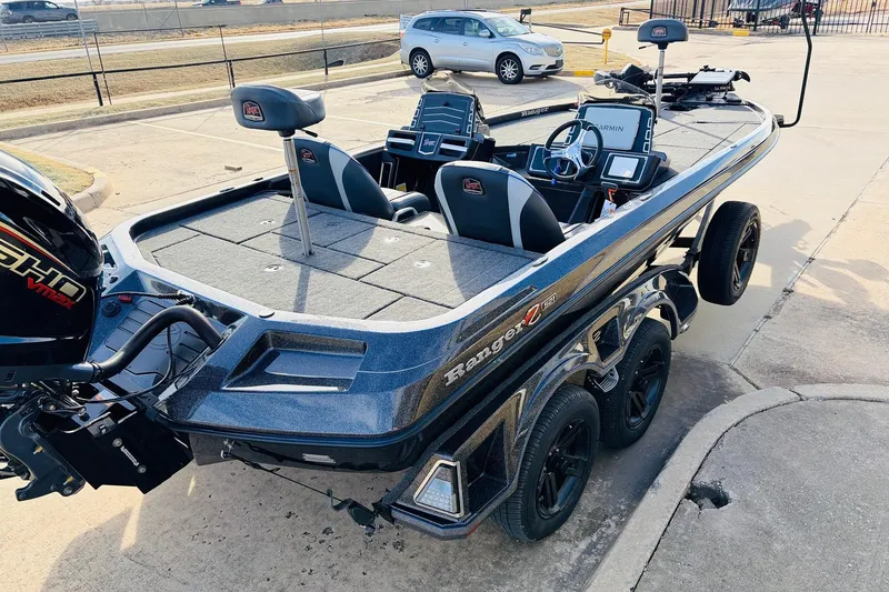 Slide: The Image of 2026 Ranger Z521 boat with dual consoles and Yamaha VMAX engine in a parking lot. - 5