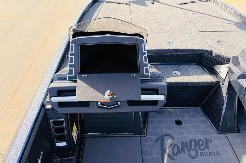Slide: The Image of 2026 Ranger Z521 boat dashboard with advanced navigation system and spacious deck. - 38