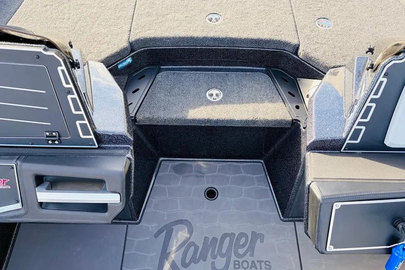 Slide: The Image of 2026 Ranger Z521 boat interior with carpeted deck and storage compartments. - 29