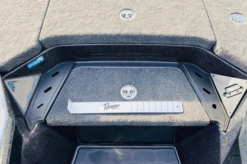 Slide: The Image of 2026 Ranger Z521 boat deck with measurement tool and storage compartments. - 32