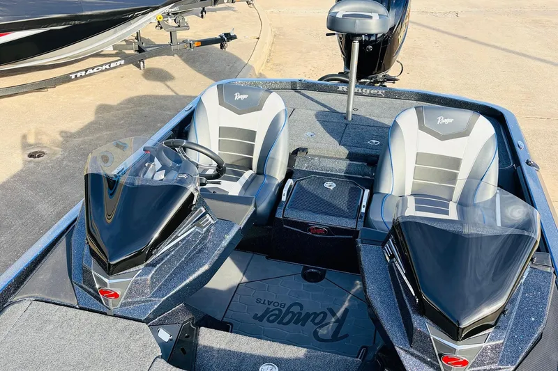Slide: The Image of 2026 Ranger Z521 boat interior with dual seats and steering console. - 35
