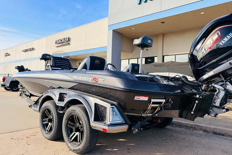Slide: The Image of 2026 Ranger Z521 boat with Yamaha engine parked outside dealership. - 8