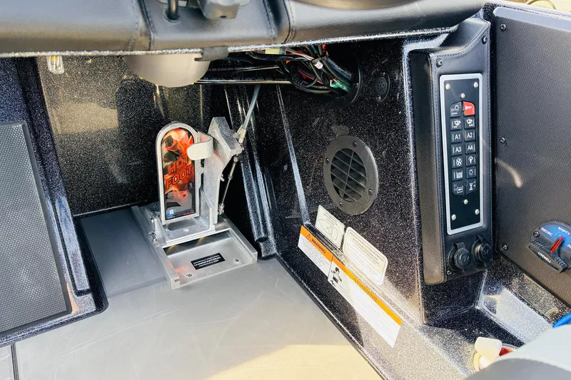 Slide: The Image of 2026 Ranger Z521 boat dashboard with control panel and foot pedal. - 46