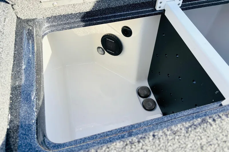 Slide: The Image of 2026 Ranger Z521 boat compartment with drainage and ventilation features. - 54