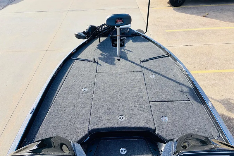 Slide: The Image of 2026 Ranger Z521 boat deck with carpeted surface and seating. - 12
