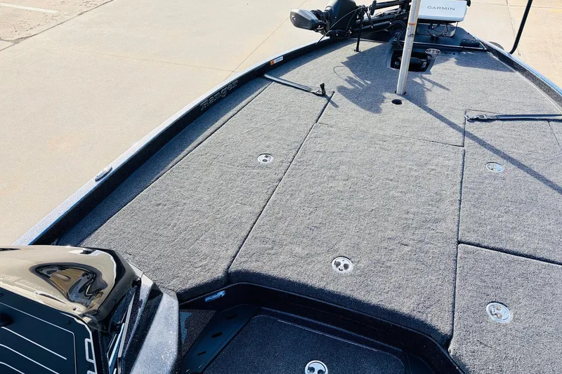 Slide: The Image of 2026 Ranger Z521 boat deck with carpeted surface and Garmin equipment. - 17