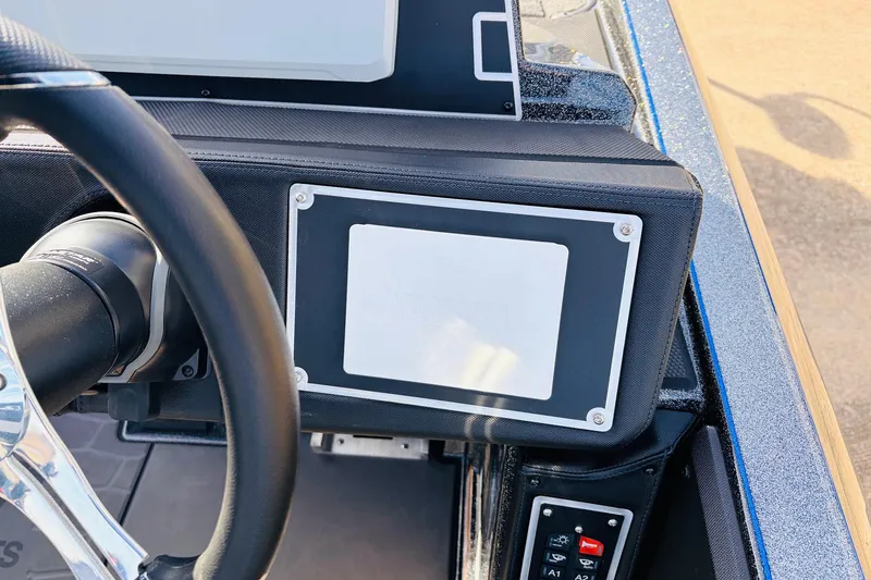 Slide: The Image of Steering wheel and dashboard of 2026 Ranger Z521 boat, featuring modern controls. - 44