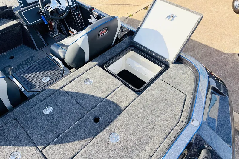 Slide: The Image of 2026 Ranger Z521 boat interior with open storage compartment and seating. - 61