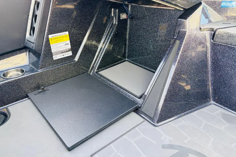 Slide: The Image of 2026 Ranger Z521 boat interior with storage compartment and seating area. - 40