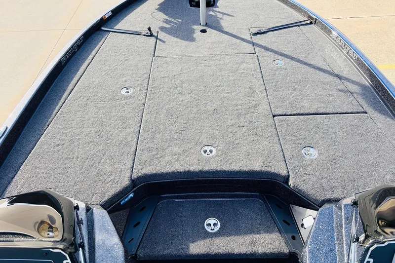 Slide: The Image of 2026 Ranger Z521 boat deck with carpeted surface and storage compartments. - 18