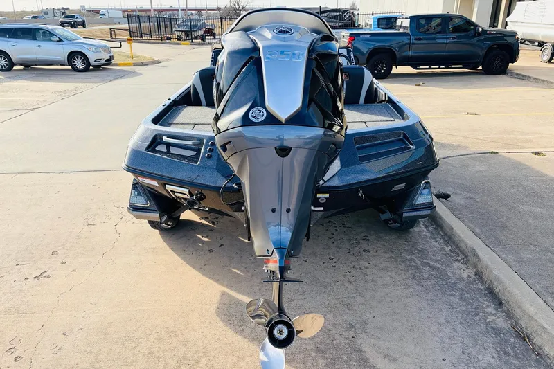 Slide: The Image of 2026 Ranger Z521 boat with powerful outboard motor, parked in a lot. - 6