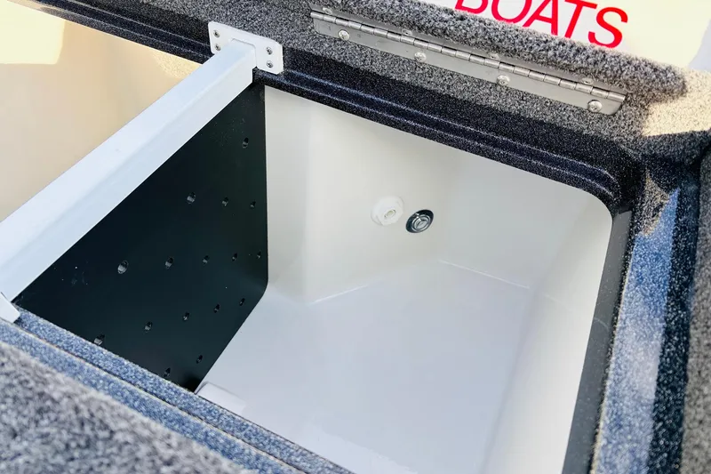 Slide: The Image of 2026 Ranger Z521 boat storage compartment with open lid and interior view. - 55