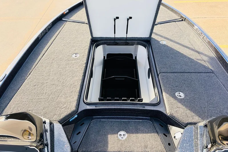 Slide: The Image of 2026 Ranger Z521 boat deck with open storage compartment, showcasing spacious design. - 22