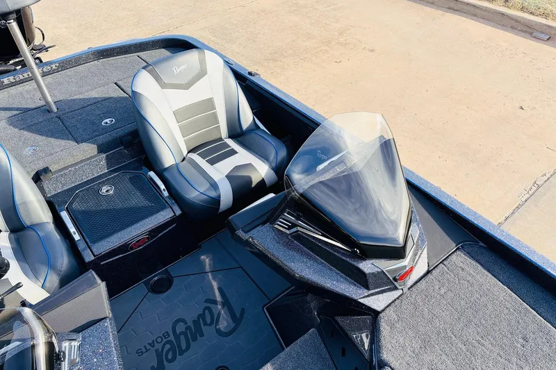 Slide: The Image of 2026 Ranger Z521 boat interior with sleek seating and modern dashboard design. - 34