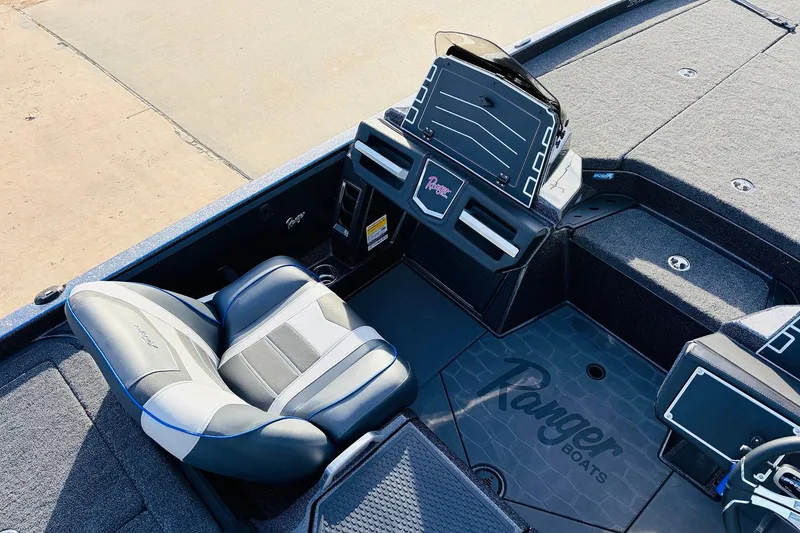 Slide: The Image of 2026 Ranger Z521 boat interior with sleek seating and modern dashboard design. - 37