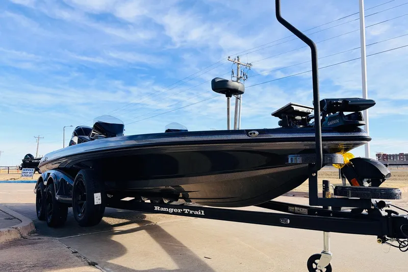 Slide: The Image of 2026 Ranger Z521 boat on trailer under clear blue sky. - 3