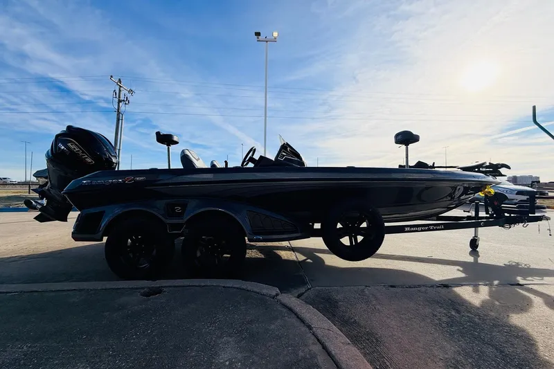 Slide: The Image of 2026 Ranger Z521 boat on trailer under clear blue sky. - 4