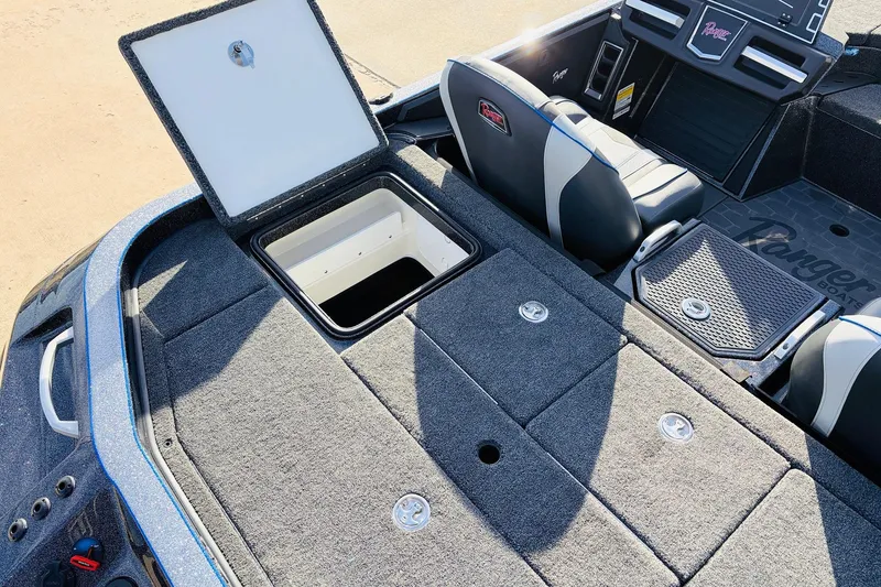 Slide: The Image of 2026 Ranger Z521 boat interior with open storage compartment and seating. - 58