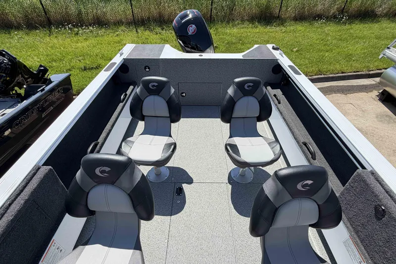 Slide: The Image of 2027 Crestliner 1850 Commander boat interior with four seats, outdoor setting. - 7