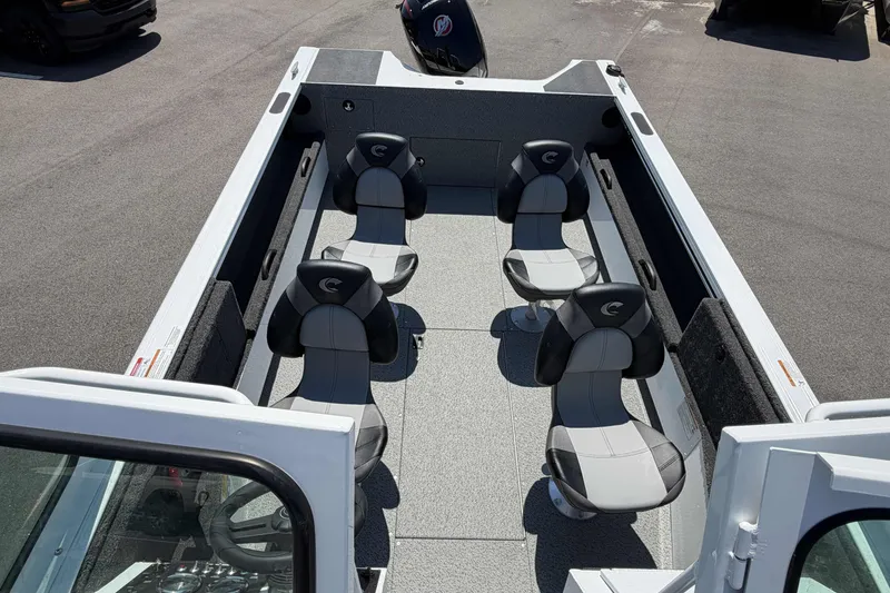 Slide: The Image of 2027 Crestliner 1850 Commander boat interior with four seats and steering console. - 17