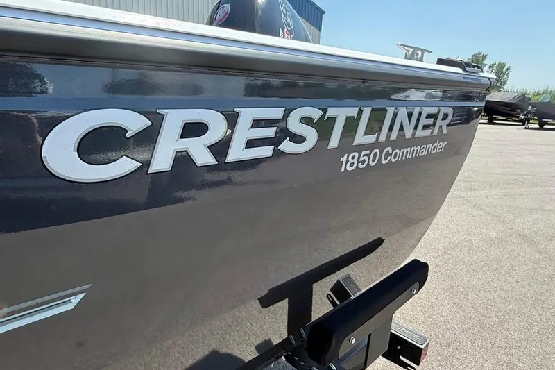 Slide: The Image of 2027 Crestliner 1850 Commander boat, close-up of logo on hull. - 19