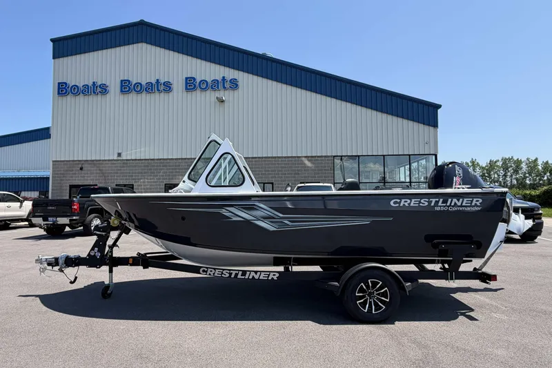 The Image of 2027 Crestliner 1850 Commander boat on trailer outside dealership. - 0
