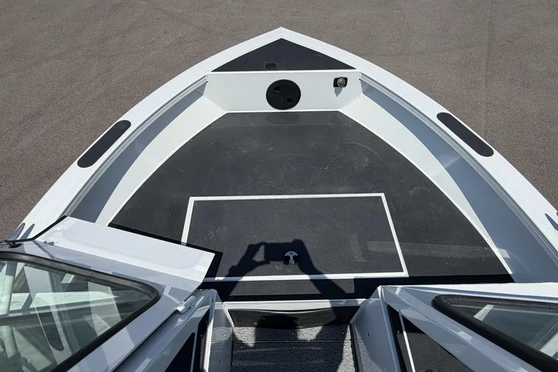 Slide: The Image of Bow view of 2027 Crestliner 1850 Commander boat, featuring spacious deck and sleek design. - 14