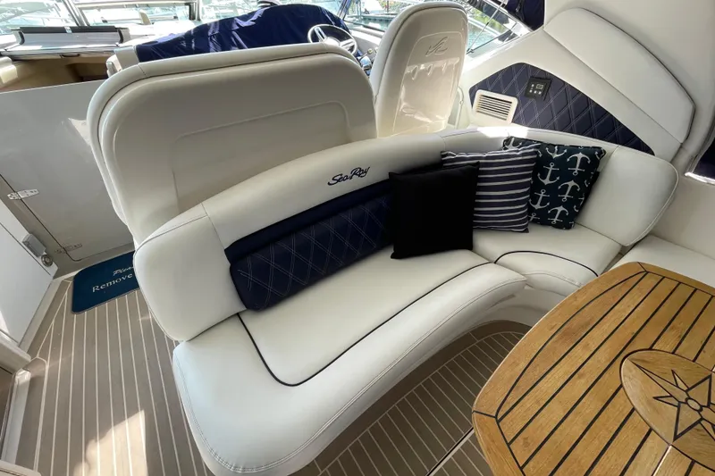 Slide: The Image of Luxurious 2007 Sea Ray 40 Sundancer yacht interior with elegant seating and nautical-themed cushions. - 14
