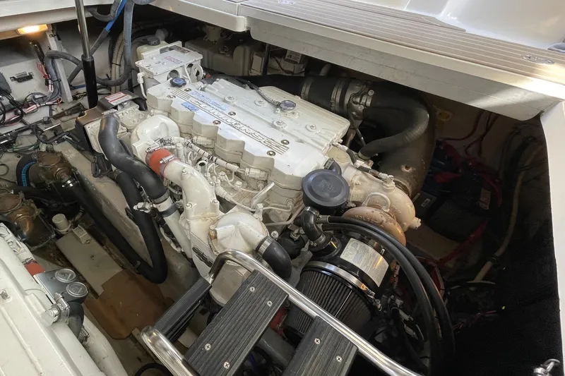 Slide: The Image of Engine compartment of a 2007 Sea Ray 40 Sundancer boat, showcasing detailed mechanical components. - 42