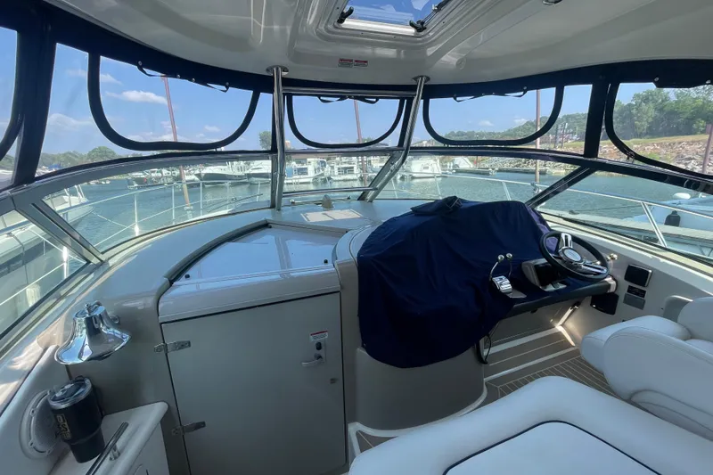Slide: The Image of Interior view of 2007 Sea Ray 40 Sundancer yacht cockpit with covered helm. - 17
