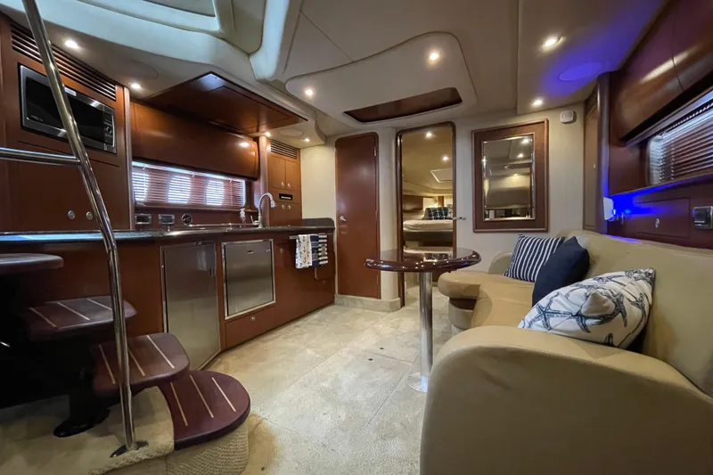 Slide: The Image of Luxurious interior of 2007 Sea Ray 40 Sundancer yacht with modern kitchen and cozy seating area. - 30