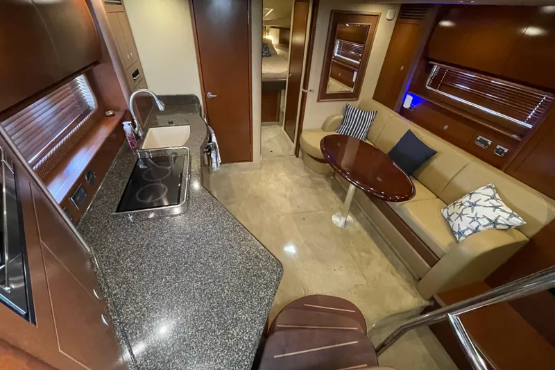 Slide: The Image of Luxurious interior of a 2007 Sea Ray 40 Sundancer yacht with modern kitchen and seating area. - 20