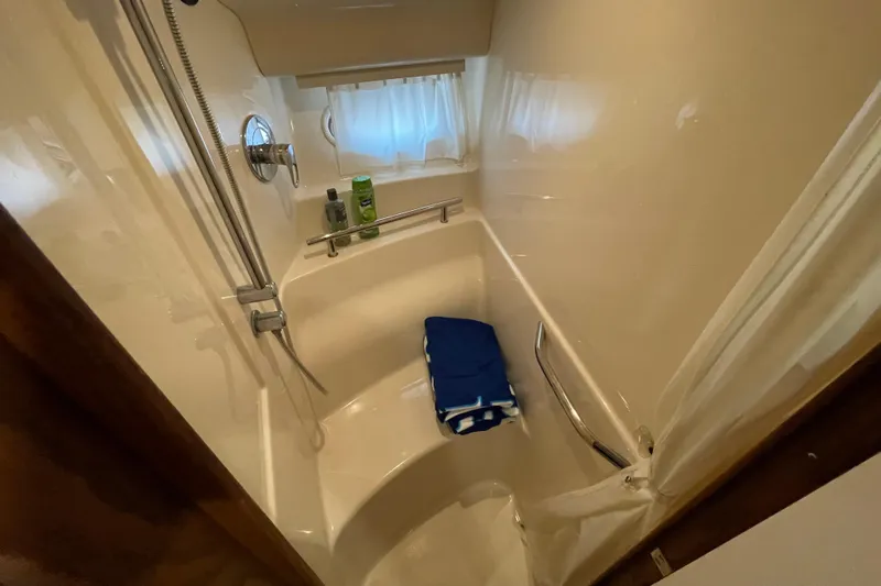 Slide: The Image of Bathroom interior of 2007 Sea Ray 40 Sundancer yacht with shower and curtain. - 35