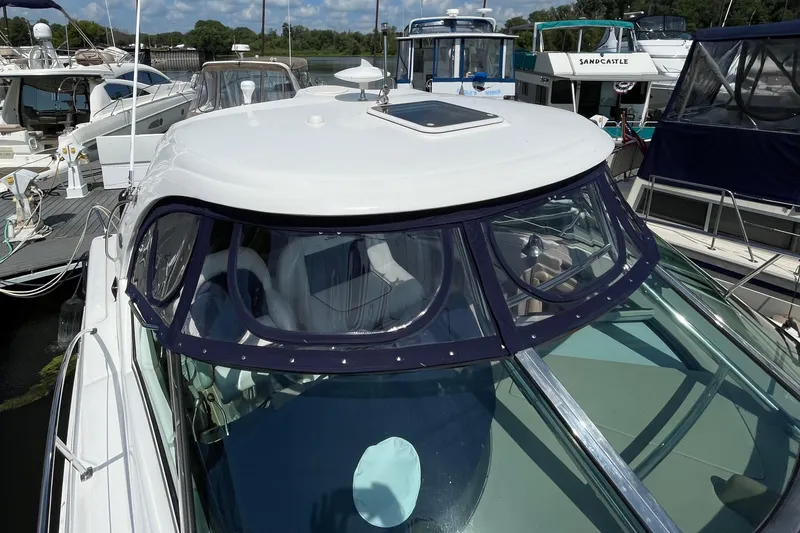 Slide: The Image of 2007 Sea Ray 40 Sundancer yacht docked at marina, featuring sleek design and spacious cockpit. - 6