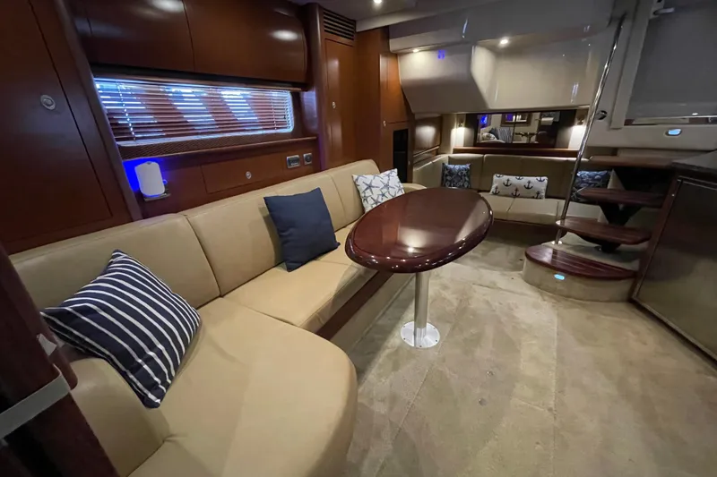 Slide: The Image of Luxurious interior of 2007 Sea Ray 40 Sundancer yacht with elegant seating and wooden accents. - 24