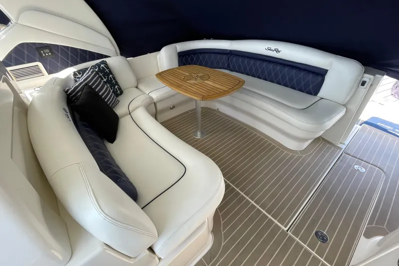 Slide: The Image of Luxurious seating area on a 2007 Sea Ray 40 Sundancer yacht with elegant cushions and table. - 12