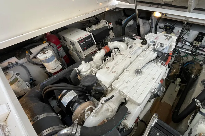 Slide: The Image of Engine room of a 2007 Sea Ray 40 Sundancer, featuring a well-maintained marine engine. - 43