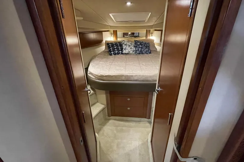 Slide: The Image of Interior cabin of 2007 Sea Ray 40 Sundancer yacht with cozy bed and nautical decor. - 32