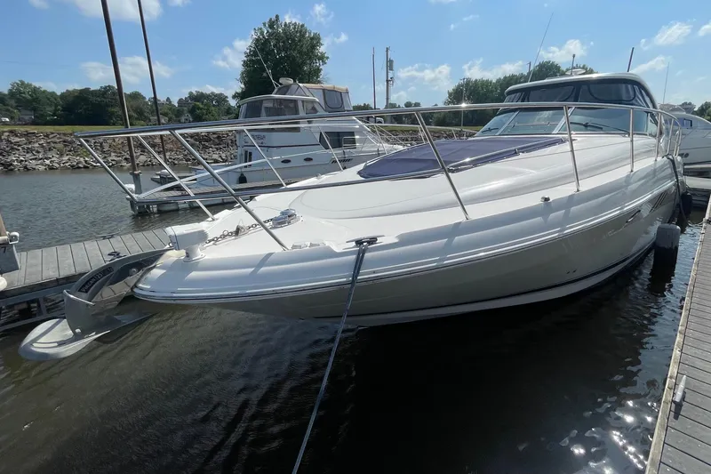 Slide: The Image of 2007 Sea Ray 40 Sundancer yacht docked at marina under clear blue sky. - 1