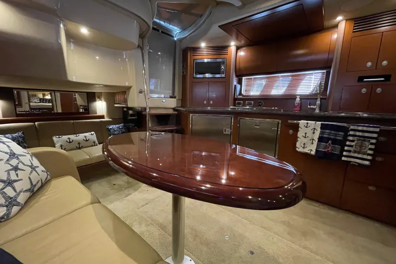 Slide: The Image of Luxurious interior of a 2007 Sea Ray 40 Sundancer yacht with elegant wood finishes. - 23
