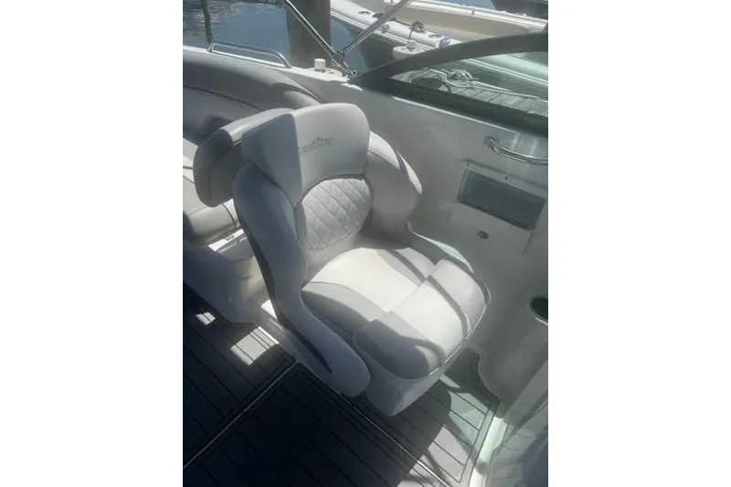 Slide: The Image of 2021 NauticStar 243 DC boat seat with quilted design and armrests. - 16