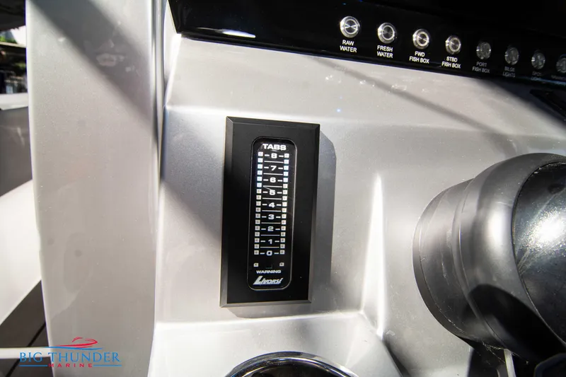 Slide: The Image of Close-up of a helm console featuring a digital control panel and multiple switches. - 45