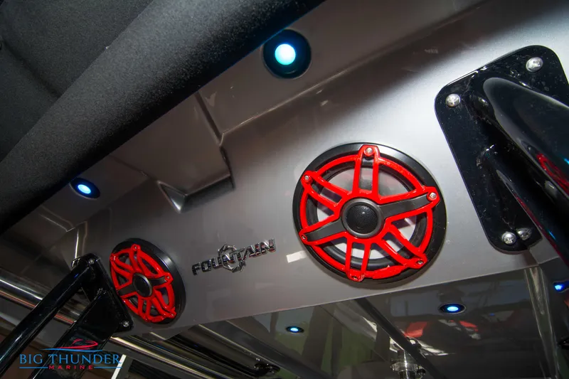 Slide: The Image of Red speakers and lighting inside a 2023 Fountain 32 NX boat. - 25
