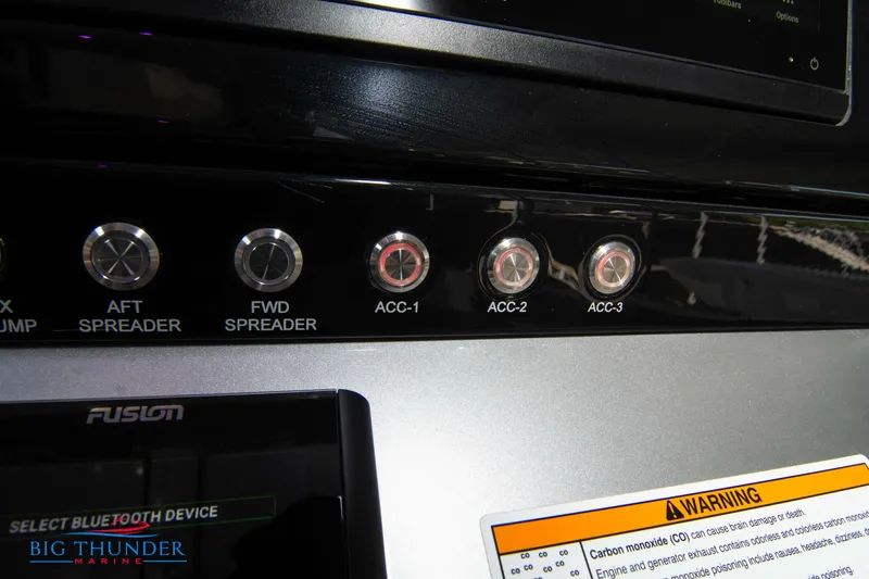 Slide: The Image of Close-up of the control panel with several switches and a warning label. - 40