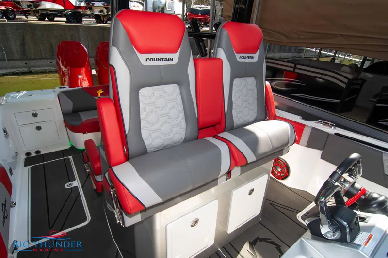 Slide: The Image of The 2023 Fountain 32 NX features luxurious red and gray seating with a modern design. - 47