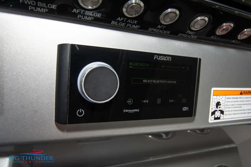 Slide: The Image of Close-up of a Fusion audio system on a 2023 Fountain 32 NX boat. - 41