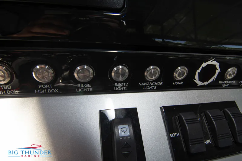 Slide: The Image of Close-up of the control panel with various switches and buttons. - 38