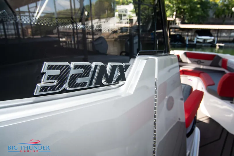 Slide: The Image of Close-up of the 2023 Fountain 32 NX with sleek design and red interior accents. - 49
