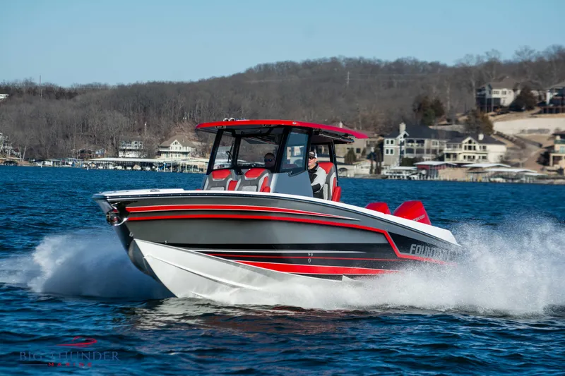 Slide: The Image of 2023 Fountain 32 NX on the water with red and black design. - 11