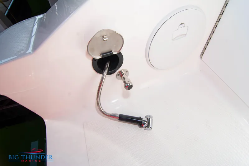 Slide: The Image of Close-up of a water fill inlet on a 2023 Fountain 32 NX boat. - 15